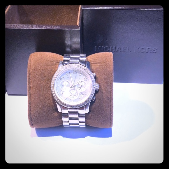 Michael Kors watch with embellished bezel .